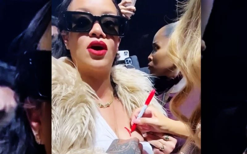 Mariah Carey Signs to Rihanna's Breast at Christmas Concert